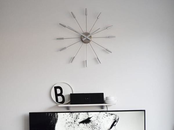 Silver Plug Inn Wall Clock on the Wall