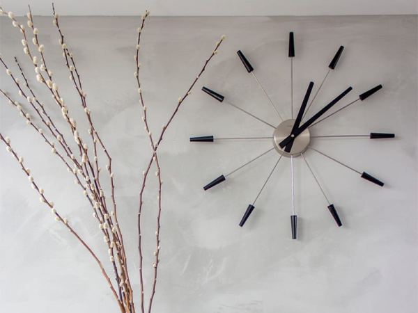 Black Plug Inn Wall Clock on the Wall