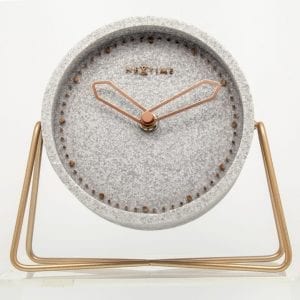 Classical and minimalist Cross Table, a simple grey clock with copper detail on a metal stand