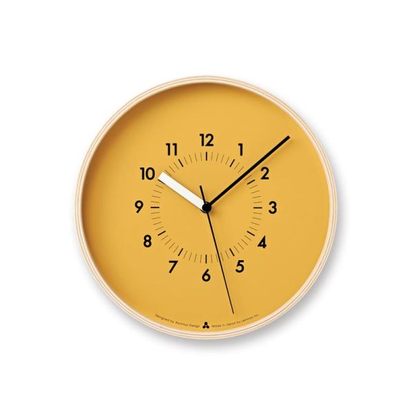 a smooth natural orange clock face with diminutive black display, and a plywood natural frame