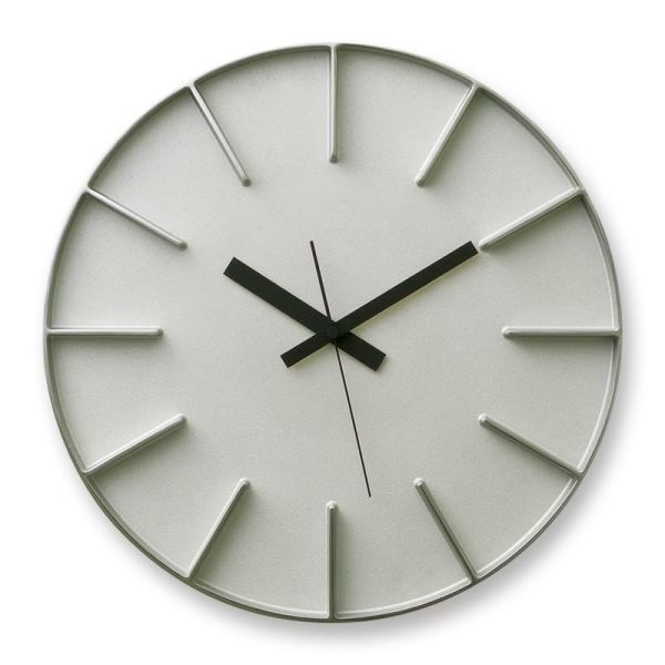 Edge wall clock in aluminium, has moulded hour markers and clear black hands