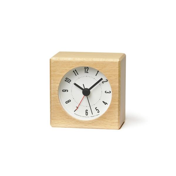 Natural beech hewn into a square clock, a small white face with black numbers