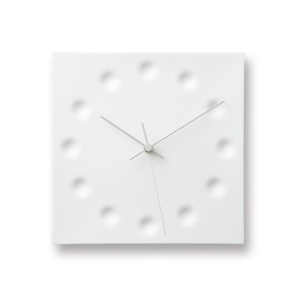Small dimples in porcelain inspired by water droplets falling onto the earth, in calm white