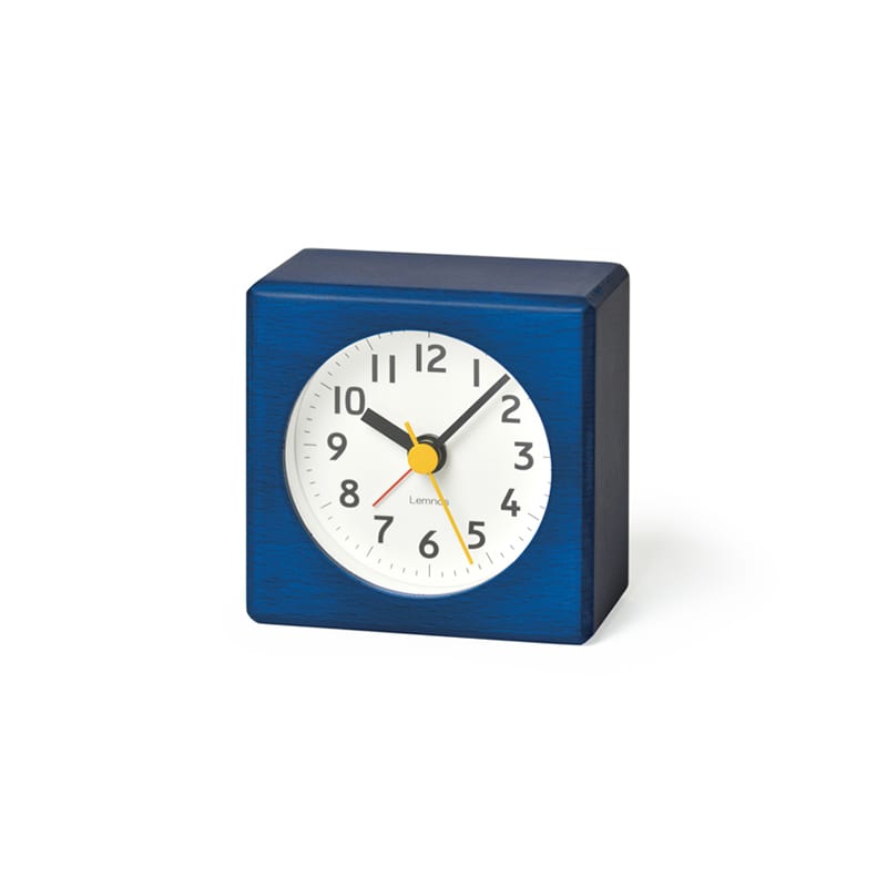 Blue Farbe is a small colourful alarm clock with a contrasting easy to read white face. The yellow second hand and red alarm hand complete the colourful look