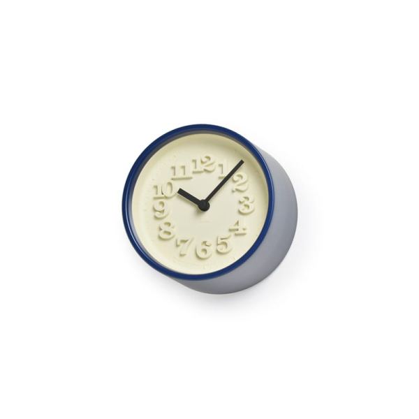 This diminutive dark blue clock has classic 70's styling