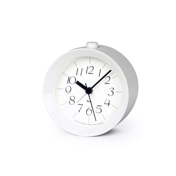 white framed round alarm clock with crisp white face and legible black numbers