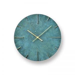 Brass with green finish, strong colours and textures with polished areas to show the detail