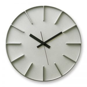 Edge wall clock in aluminium, has moulded hour markers and clear black hands