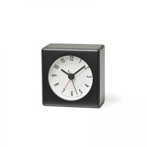 Small alarm clock made from beech, black coloured with a white face. Tiny but powerful.