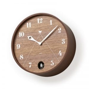 wooden cuckoo clock in walnut cuckoos the hours away