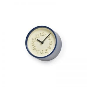 This diminutive dark blue clock has classic 70's styling