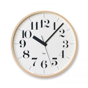 Classsic version of the Riki Clock, with clear easy to read numbers on crisp white, seated within a natural wood frame