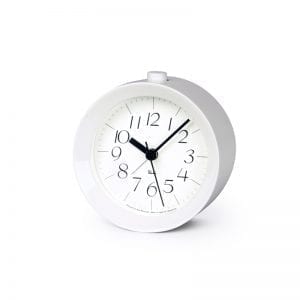 white framed round alarm clock with crisp white face and legible black numbers