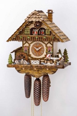Two woodcutters decorate this elaborate cuckoo clock, which has movement and music