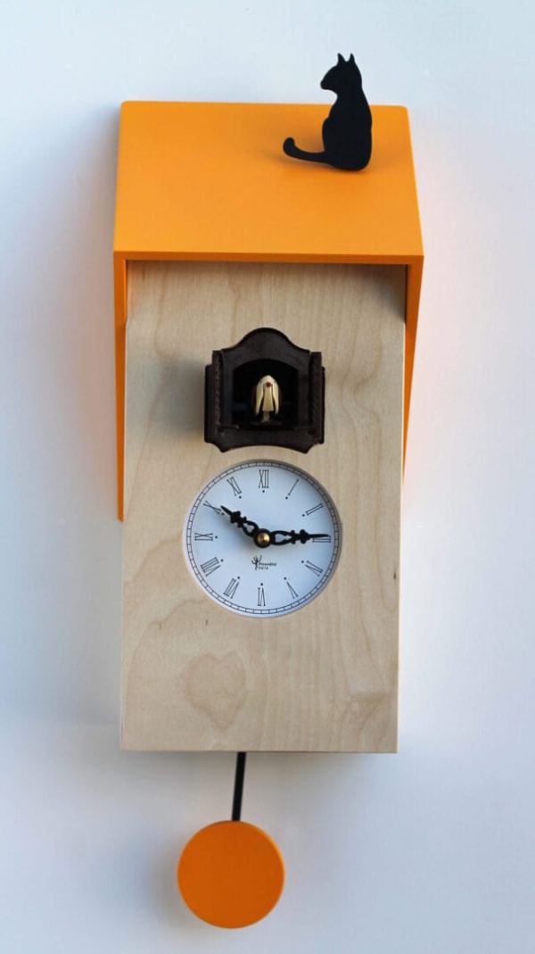 Cucu Vicenza clock in natural wood with a yellow mdf roof which has a cat sitting on it. The cuckoo peeps from a house above the clock face