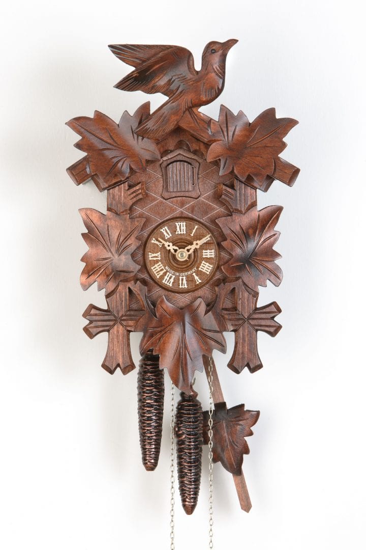 Wooden cuckoo and leaves decorate this quartz cuckoo clock