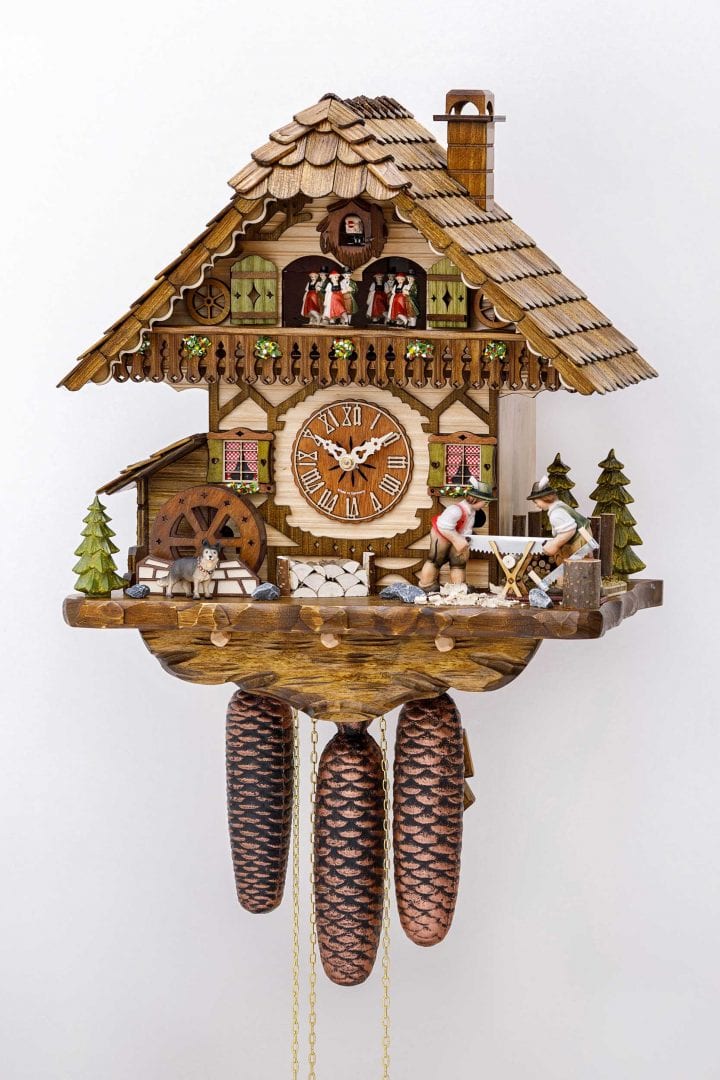 Two woodcutters decorate this elaborate cuckoo clock, which has movement and music