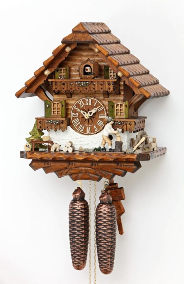 This clock features a woodcutter hard at work outside his chalet