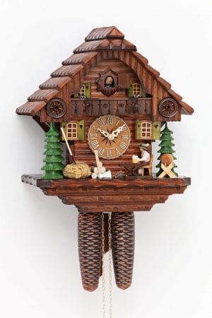 Traditional rustic cuckoo clock with beerdrinking woodcutter