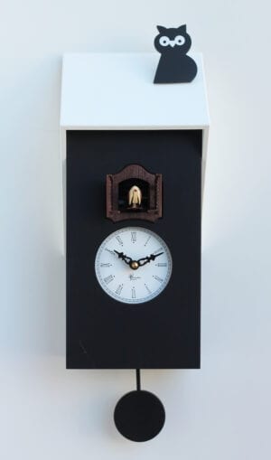 Super quirky cuckoo clock in black mdf with a white face, white roof and topped by a black cat. The cuckoo appears from its home just above the clock face
