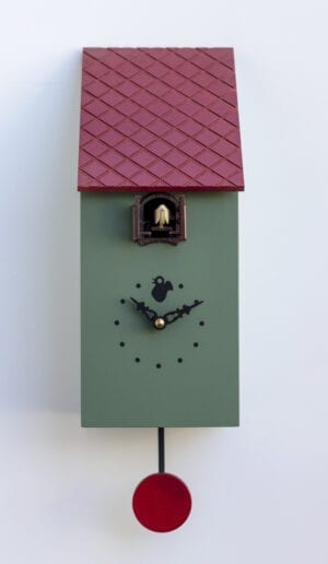 A birdhouse cuckoo clock in RAL 6011 green, with black detail and a red rood.