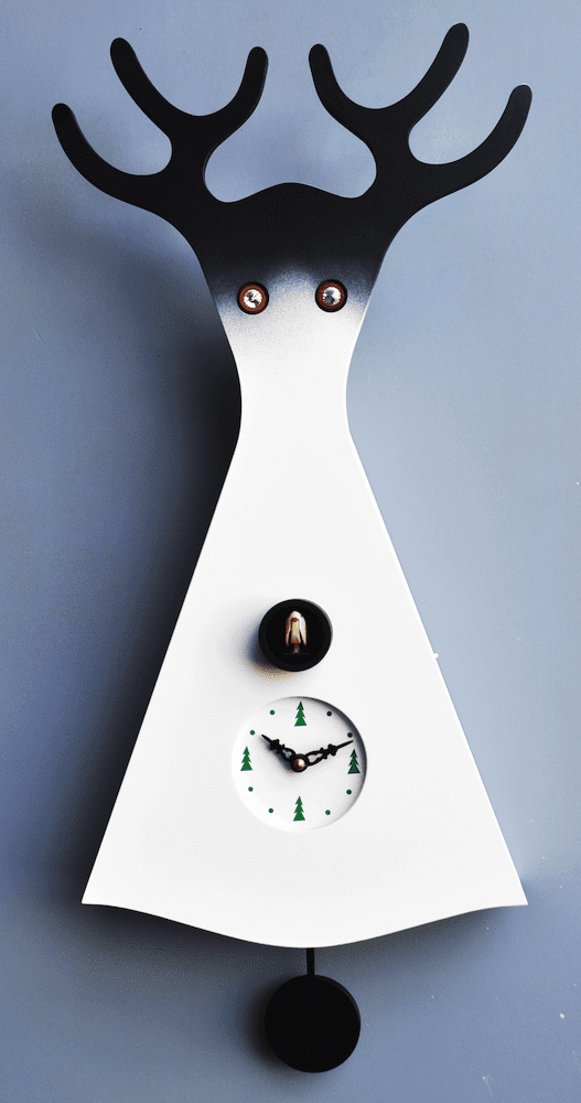 //////stelvio cuckoo clock in the form of a deer, white with black detail, and trees marking the quarter hours of the clock face