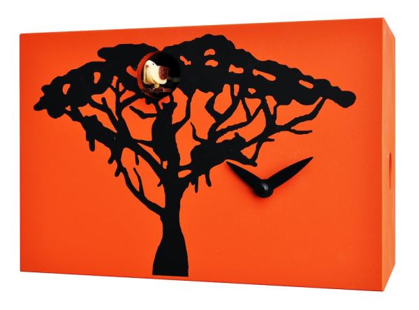 A tree and leopards silhouetted against an orange savannah sky