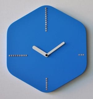 Blue clock in the form of a hexagon, with wooden dots showing the 3 6 9 12