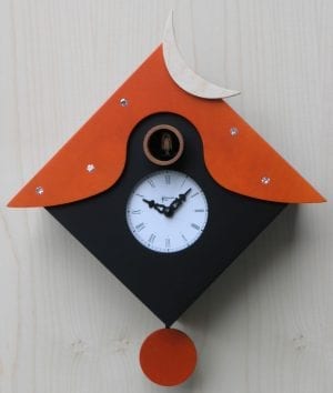 black and orange cuckoo clock with crescent moon over roof