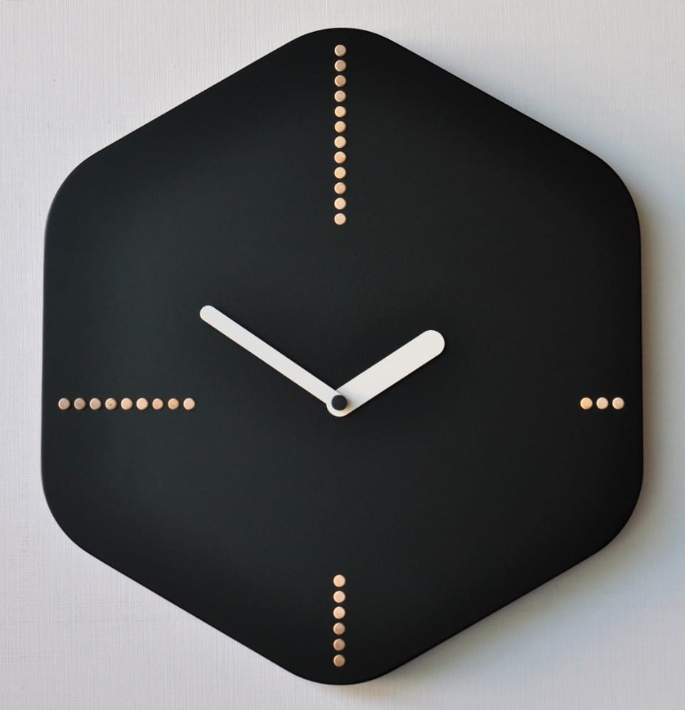 Hexagon in black with wooden pegs on the quadrants