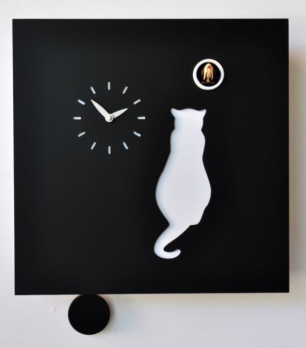 A black clock with white cat, waiting for the cuckoo, and white clock face