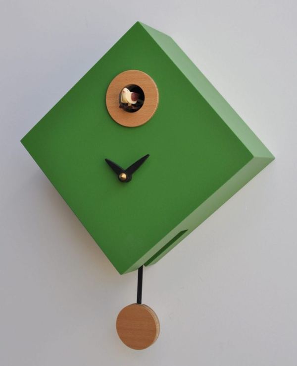 Green clock with natural wood, the cuckoo lives at the 12 position and there is also a pendulum