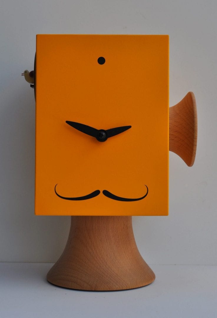 a unique clock with the appearance of salvador dali, in orange with wood detailing