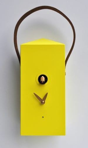 A small yellow cuckoo clock in the form of a lantern with leather strap