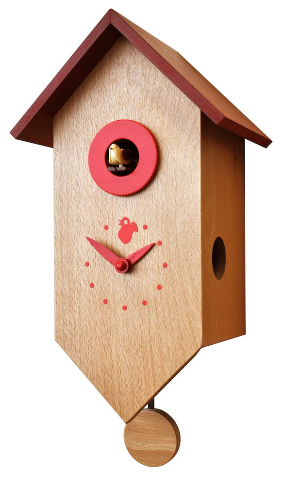 A bird house shaped cuckoo clock in natural wood with red roof and detail