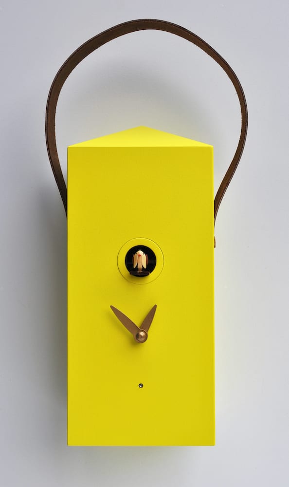 A small yellow cuckoo clock in the form of a lantern with leather strap