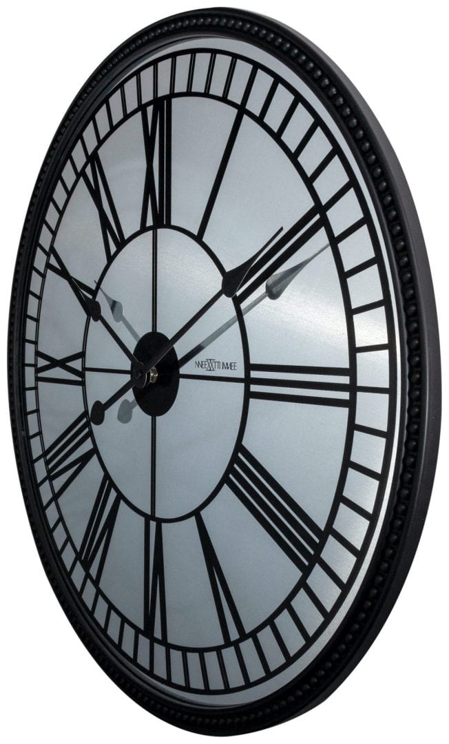 Side view of the Cleopatra wall clock, showing how the mirror finish reflects the light, and contrasts with the black roman numerals