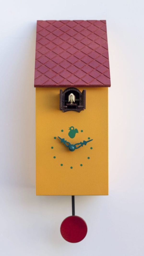 Portofino cuckoo clock in melon yellow with burgundy tile effect roof, red pendulum, grey clock details and cuckoo housed just under the eaves