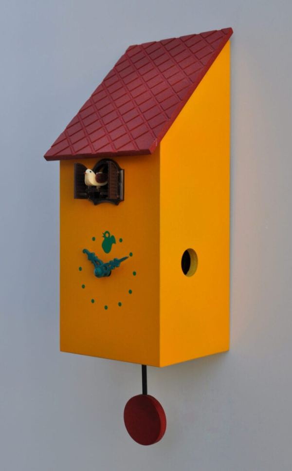 Melon yellow cuckoo clock with red roof and pendulum, cuckoo pops from under the eaves
