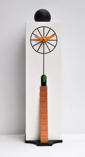 An unusual cuckoo clock designed by Giovanni Pirondini, with a white case, printed with a clockface if the form of a wheel, with a small opening above for the cuckoo, and a latter leading to a small hole below the clock face.