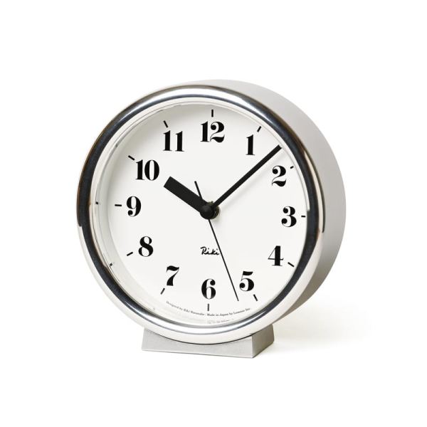 RIKI aluminum wall or desk clock, made of cast polished aluminium, with a clear face, a small clock by designer Riki Watanabe