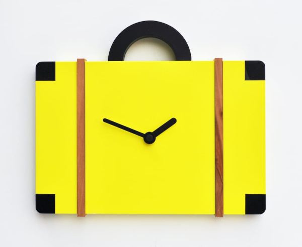 An unusual cuckoo clock in the form of a suitace, presented in sulphur yellow with black detail.