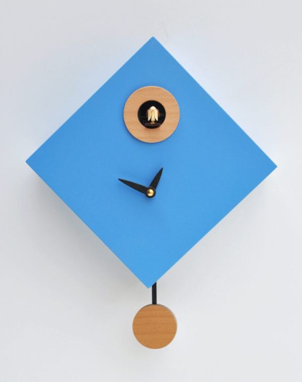Light blue diamond shaped cuckoo clock with black hands and wooden detail