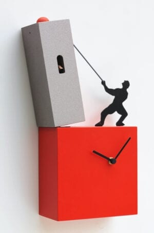 Lo Tengo Cuckoo Clock in grey and red. A black figure pulls the top grey tower, whilst standing on the bottom red block