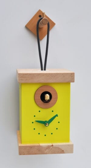 Cucu Titti, a bright yellow cuckoo clock in the in the form of a hanging lantern, complete with hanging hook,