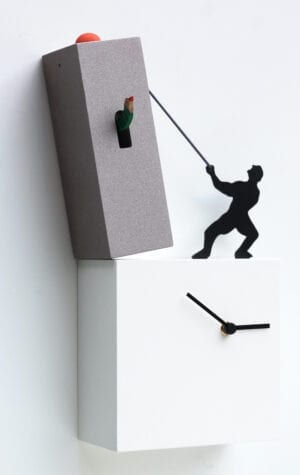 Lo Tengo is a cuckoo clock full of fun and humour - a silhoutte of a figure which uses a rope to hold the toppling tower which containing the cuckoo element of the clock. The figure is standing on the lower element of the clock which has the clock face in white.