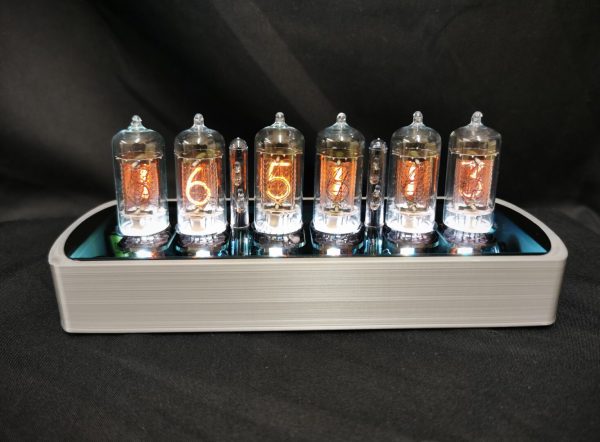 Front view of Genesis SS in silver with backlit nixie tubes