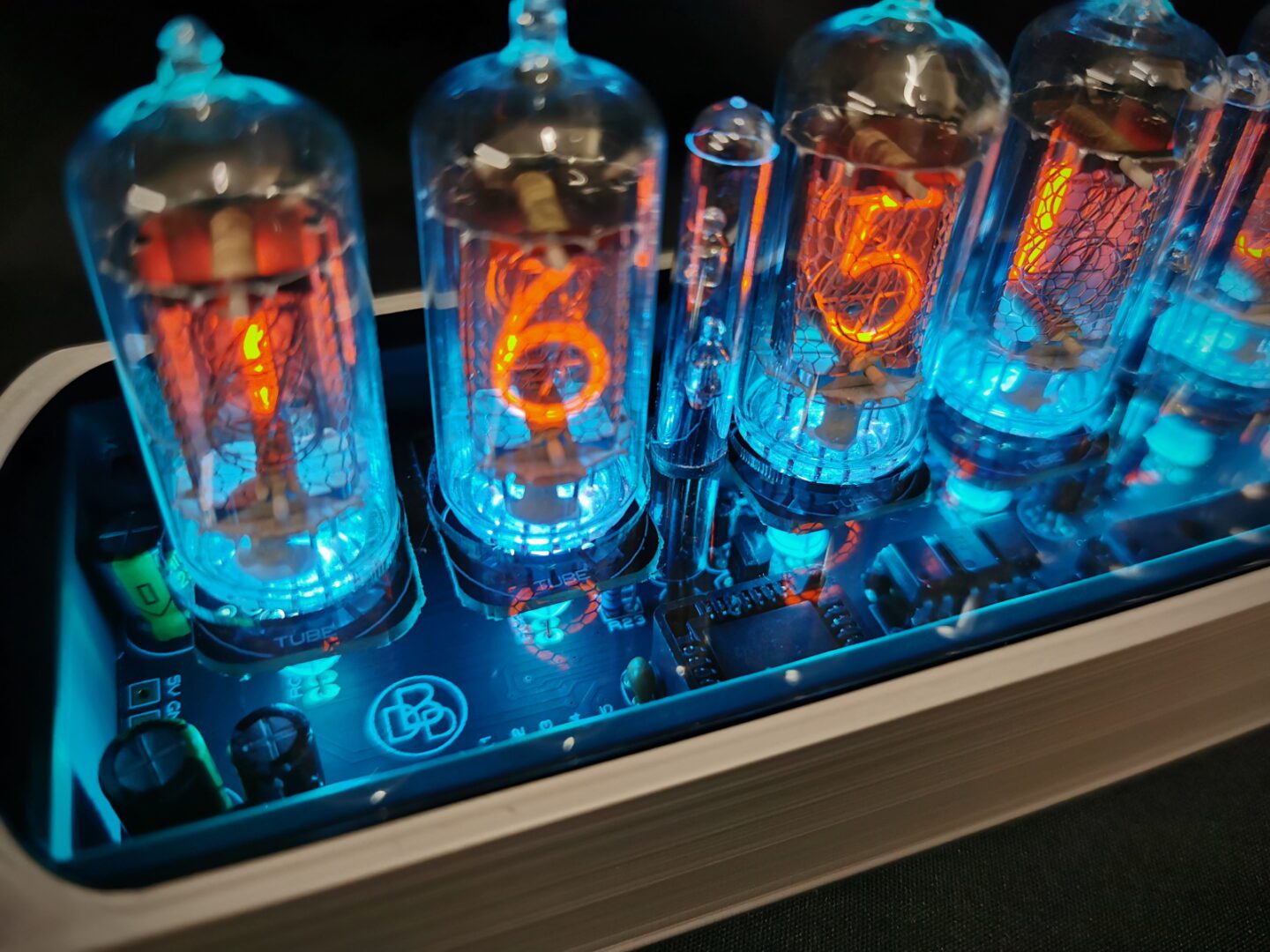 Closeup of Genesis nixie clock showing smoked top for viewing of internal workings