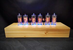 Cadence clock in cedar, showing graining of the wood, which is individual to each clock, and back lit nixie tubes