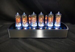 Genesis CS - black chrome coloured case with blue back lit nixie tubes, viewed from the front